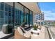 Private balcony with comfortable seating, offering breathtaking city views at 1000 Water St # 1402, Tampa, FL 33602