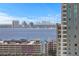 High-rise view showcasing a cityscape with water and distant buildings at 1000 Water St # 1402, Tampa, FL 33602