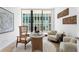 Home office with wood desk and comfortable seating at 1000 Water St # 1402, Tampa, FL 33602