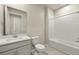 Clean bathroom with a bathtub, toilet and single vanity at 12395 Hearts Ease St, Venice, FL 34293