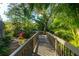 Wooden walkway winds through lush tropical landscaping at 1473 Landings Cir # 44, Sarasota, FL 34231