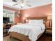 This bedroom features an elegant headboard, and bedside table with a table lamp at 532 Beach Ne Dr, St Petersburg, FL 33701