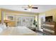This well lit bedroom features a full dresser and views of the outdoors at 532 Beach Ne Dr, St Petersburg, FL 33701