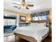 This bedroom features a ceiling fan and a sitting area connected to it at 532 Beach Ne Dr, St Petersburg, FL 33701