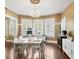 Elegant dining room featuring a chandelier, large windows, and hardwood floors at 532 Beach Ne Dr, St Petersburg, FL 33701