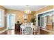 Elegant dining room featuring a chandelier, large windows, and hardwood floors at 532 Beach Ne Dr, St Petersburg, FL 33701