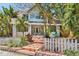 Charming two-story home features a welcoming front entrance and lush tropical landscaping at 532 Beach Ne Dr, St Petersburg, FL 33701