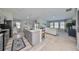 Open concept kitchen with island and view of living room at 13114 Shumard Way, Riverview, FL 33579