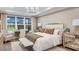 Spacious main bedroom with large windows and sitting area at 16285 Alpha Grove Pl, Odessa, FL 33556