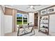 Bright home office with built-in shelving and large window at 16285 Alpha Grove Pl, Odessa, FL 33556