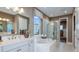 Luxurious bathroom with soaking tub and walk-in shower at 16285 Alpha Grove Pl, Odessa, FL 33556