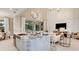 Open concept kitchen with island, stainless steel appliances, and view to Gathering room at 16285 Alpha Grove Pl, Odessa, FL 33556