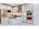 Spacious kitchen featuring a large island and stainless steel appliances at 16285 Alpha Grove Pl, Odessa, FL 33556
