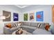 Cozy theater room with sectional sofa and movie posters at 16285 Alpha Grove Pl, Odessa, FL 33556