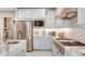 Modern kitchen with stainless steel appliances and white cabinets at 16285 Alpha Grove Pl, Odessa, FL 33556