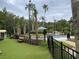 Landscaped pool area with a view of the playground at 16206 Nottingham Park Way, Tampa, FL 33647