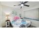 Stylish bedroom featuring modern decor, beach-themed accents, and natural light at 1906 2Nd St, Indian Rocks Beach, FL 33785