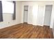 Bedroom featuring wood floors, a window, and closet at 4254 96Th N Ter # Two, Pinellas Park, FL 33782