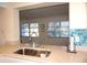 View of the kitchen sink with white countertops and bright backsplash at 4254 96Th N Ter # Two, Pinellas Park, FL 33782