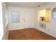 Cozy living room area featuring natural light, wood floors, and kitchen view at 4254 96Th N Ter # Two, Pinellas Park, FL 33782