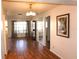 Inviting living room showcasing wood floors, chandelier, and natural light at 4254 96Th N Ter # Two, Pinellas Park, FL 33782