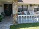 Front porch with stone column, tiled floor and seating area at 4608 Apple Ridge Ln, Tampa, FL 33624