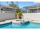 Inviting swimming pool featuring a jacuzzi tub and tiled pool deck at 4608 Apple Ridge Ln, Tampa, FL 33624