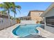 Sparkling swimming pool with spa, patio, and landscaping, creating an oasis for relaxation at 4608 Apple Ridge Ln, Tampa, FL 33624