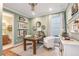 Bright home office with built-in shelves and a view of the bathroom at 16240 Alpha Grove Pl, Odessa, FL 33556