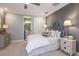 Cozy bedroom with ensuite bathroom and neutral decor at 16240 Alpha Grove Pl, Odessa, FL 33556