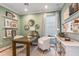 Bright home office with built-in shelves and a view of the bathroom at 16240 Alpha Grove Pl, Odessa, FL 33556