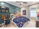 Themed bedroom with space for studying and sleeping at 16240 Alpha Grove Pl, Odessa, FL 33556