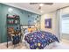 Themed bedroom with space for studying and sleeping at 16240 Alpha Grove Pl, Odessa, FL 33556