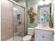 Modern bathroom with glass shower and single vanity at 16240 Alpha Grove Pl, Odessa, FL 33556