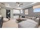 Game room features a sectional sofa, wet bar, and game table at 16240 Alpha Grove Pl, Odessa, FL 33556