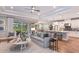 Open floor plan with a modern kitchen and spacious living area with hardwood floors at 16240 Alpha Grove Pl, Odessa, FL 33556