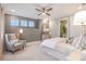 Bright bedroom with ensuite bathroom and sitting area at 16240 Alpha Grove Pl, Odessa, FL 33556