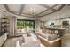 Open floor plan with modern kitchen island, and spacious living area at 11178 Manor House Ln, Odessa, FL 33556