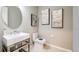 Modern powder room featuring a pedestal sink and toilet at 11178 Manor House Ln, Odessa, FL 33556