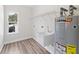 Laundry room with utility sink and water heater at 6435 Finance Ave, Weeki Wachee, FL 34607