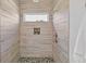 Walk-in shower with pebble floor and modern fixtures at 6435 Finance Ave, Weeki Wachee, FL 34607