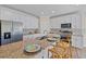 Modern kitchen boasts granite countertops, stainless steel appliances, and white cabinetry at 6435 Finance Ave, Weeki Wachee, FL 34607