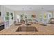Kitchen island with granite countertop and stainless steel sink overlooks the dining area at 6435 Finance Ave, Weeki Wachee, FL 34607