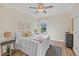 Spacious bedroom with ceiling fan and large window at 6435 Finance Ave, Weeki Wachee, FL 34607