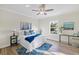Bright bedroom with a queen bed, wood flooring and a window with natural light at 6435 Finance Ave, Weeki Wachee, FL 34607
