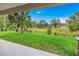 Enjoy the view from covered patio, overlooking a grassy backyard at 6435 Finance Ave, Weeki Wachee, FL 34607