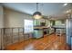 Renovated kitchen with light green cabinets and wood flooring at 205 S Occident St, Tampa, FL 33609