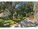 Landscaped backyard with lush greenery, a fountain, and hot tub at 1906 2Nd St, Indian Rocks Beach, FL 33785
