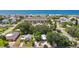 Aerial view of beach-side homes with lush landscaping and ocean views at 1906 2Nd St, Indian Rocks Beach, FL 33785