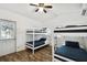 Bright bedroom with two bunk beds, offering ample sleeping space for guests at 1906 2Nd St, Indian Rocks Beach, FL 33785
